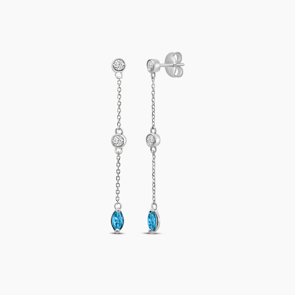 0.25 CTW Bezel Set Diamond and Blue Topaz Station Earring